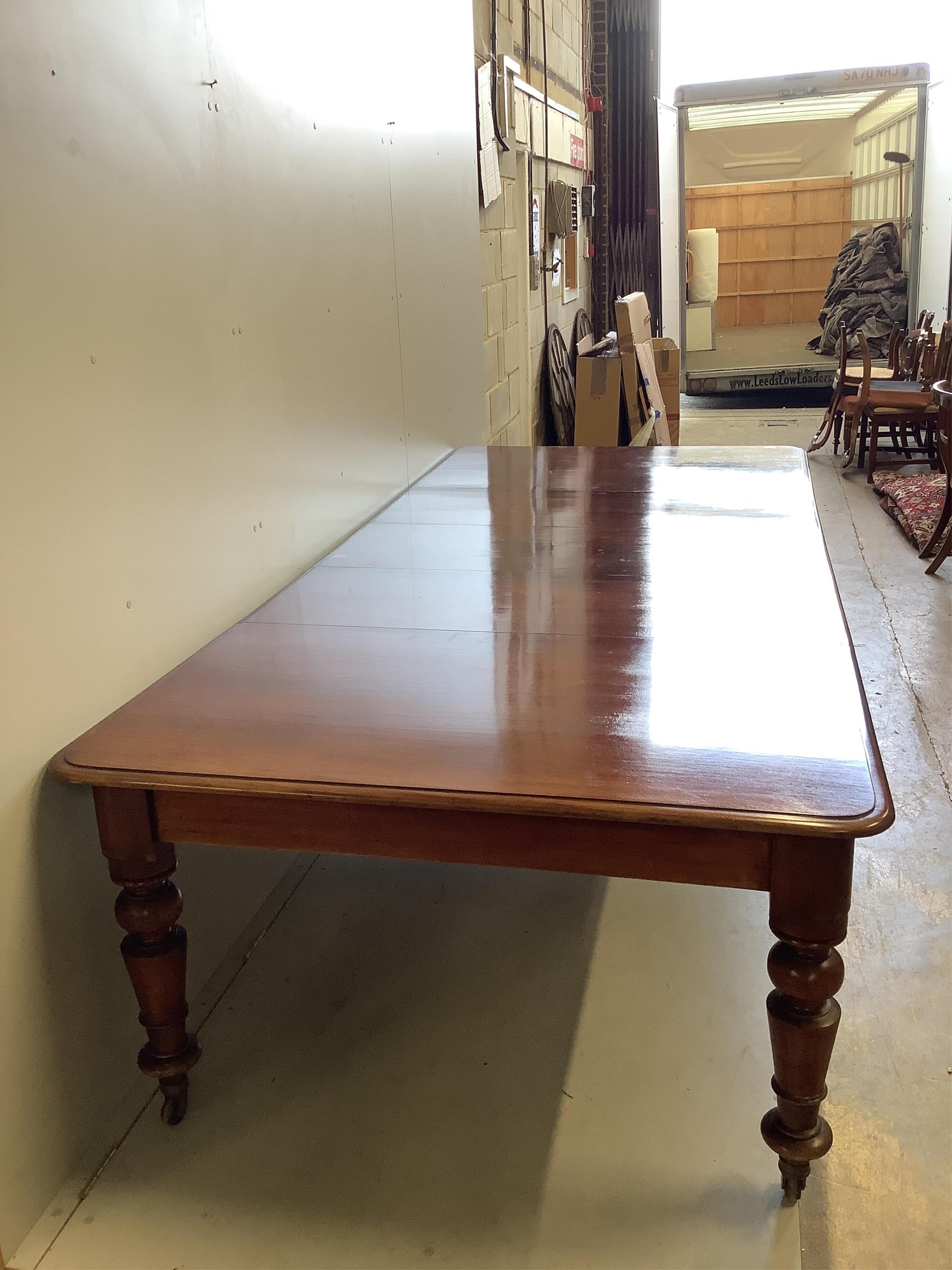 A Victorian rectangular mahogany extending dining table, 280cm extended, three spare leaves, depth 130cm, height 74cm. Condition - fair to good